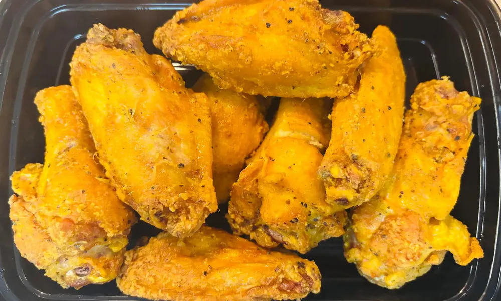 Crispy seasoned fried chicken wings takeout tray at Osaka Hibachi & Sushi, a Japanese Restaurant in Bainbridge