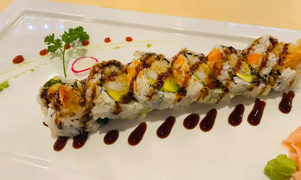 Shrimp tempura sushi roll dark soy glaze plated garnish at Osaka Hibachi & Sushi, a Japanese Restaurant in Bainbridge